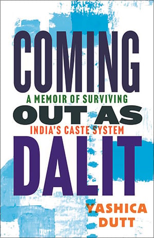 The book cover: the title Coming Out as Dalit in large purple and dark letters over blue brushstrokes on white, with the subtitle A Memoir of Surviving India's Caste System and the author's name, Yashica Dutt, in orange
