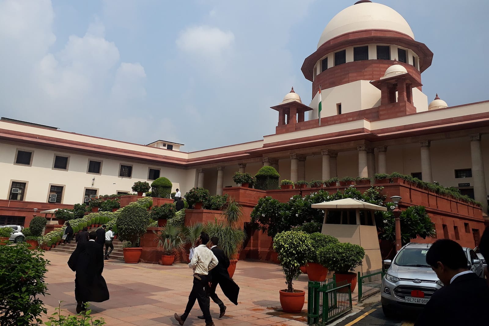 Lawyers cross the courtyard inside the Supreme Court of India complex in New Delhi